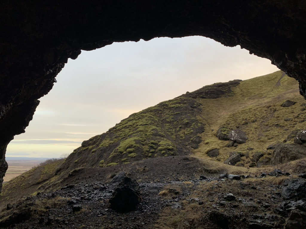 Icelandic landscape photograph taken from within the opening of a cave