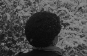 alt text: image is a black-and-white image of the back of a woman's head; title card for "All the Women I Know" by Christine Hume & Laura Larson