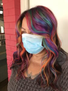 Image shows the author as a grown woman with rainbow hair.